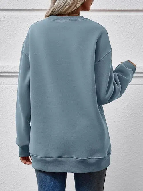 Graphic Round Neck Long Sleeve Sweatshirt Trendsi
